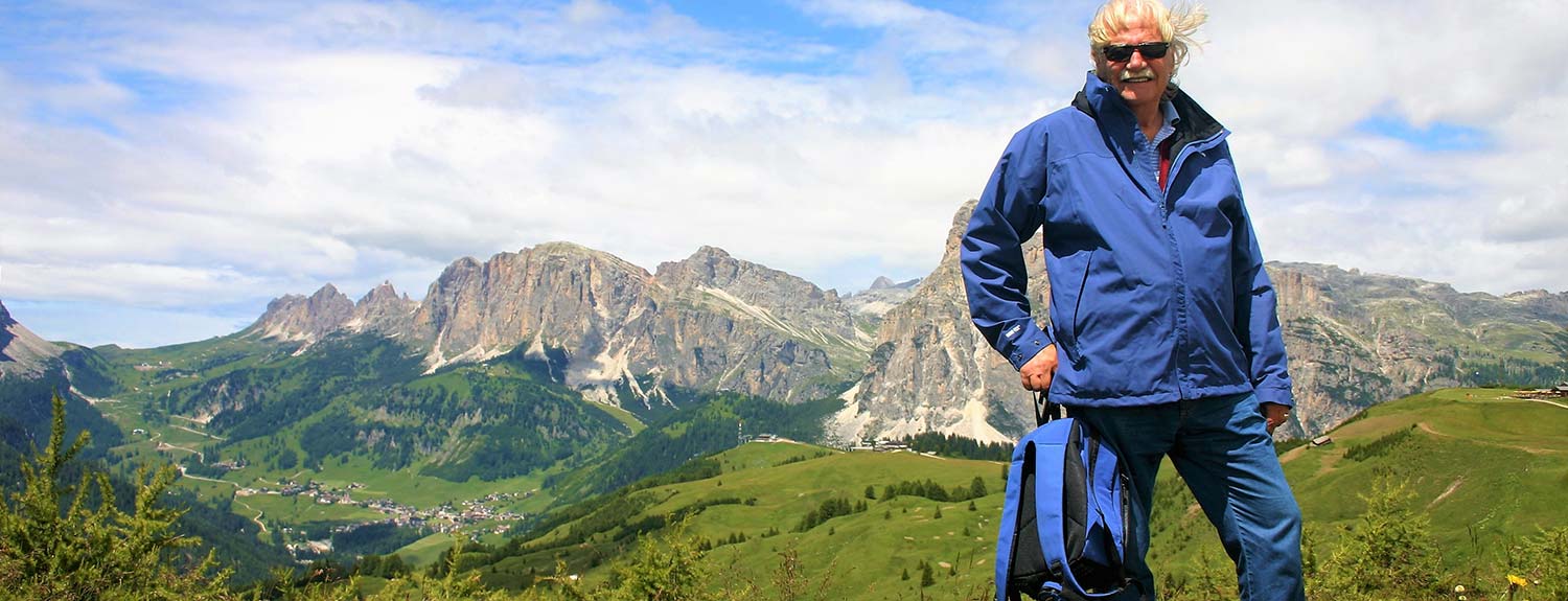 Man standing with Dolomites in the background
