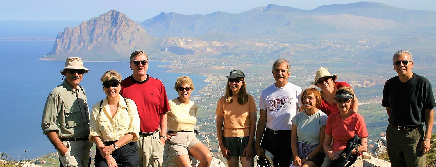 Walking tour group above the sea near Erice, Sicily