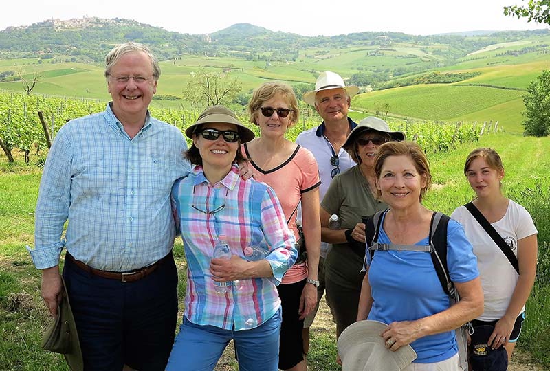 A walking tour group in the Italian countryside