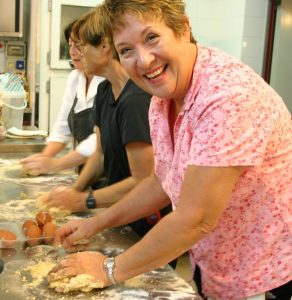 Ladies making fresh pasta in Italy